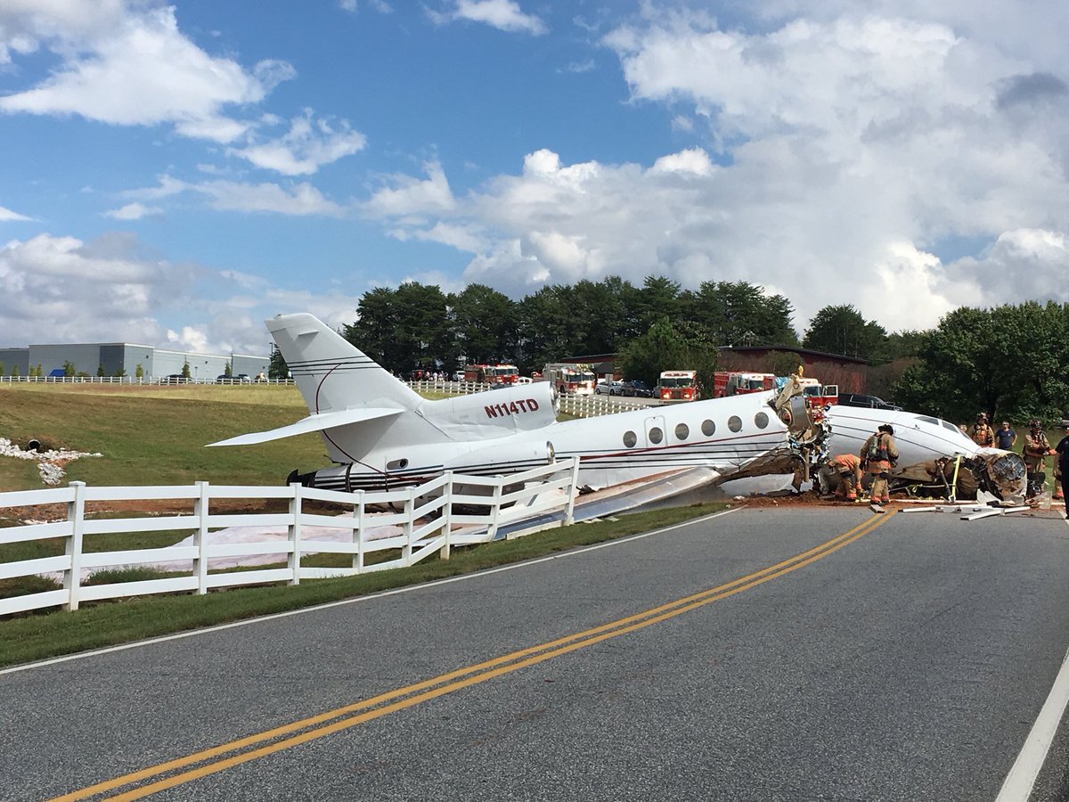 Falcon 50 jet overshot the Downtown @Greenville_SC airport. 4 people on board. One passenger still trying to get off plane. Two crew members, two passengers. One serious injury. 