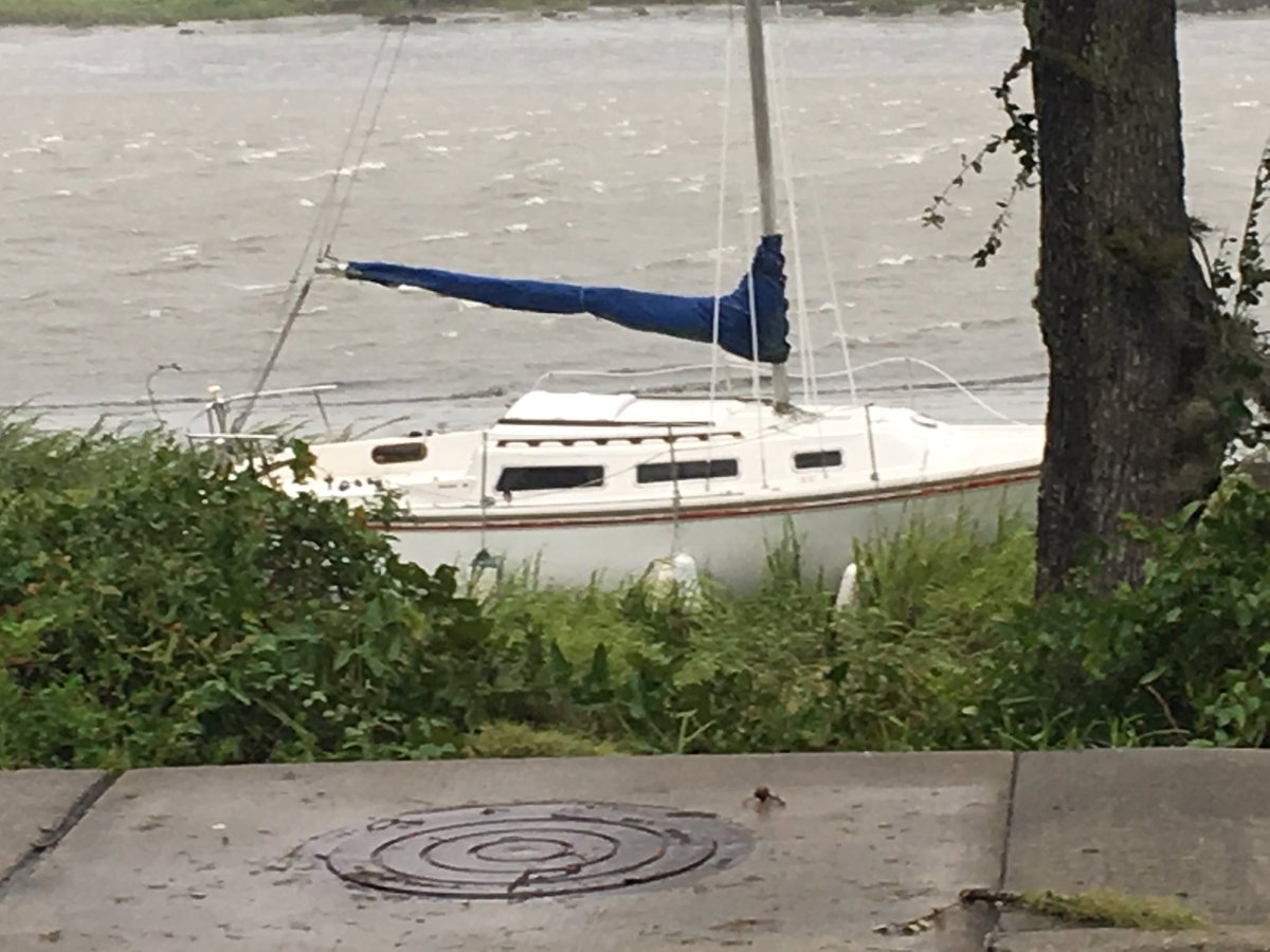 Boat pushed ashore, just to show you the winds still in effect right   on the Sea Island Parkway, Beaufort