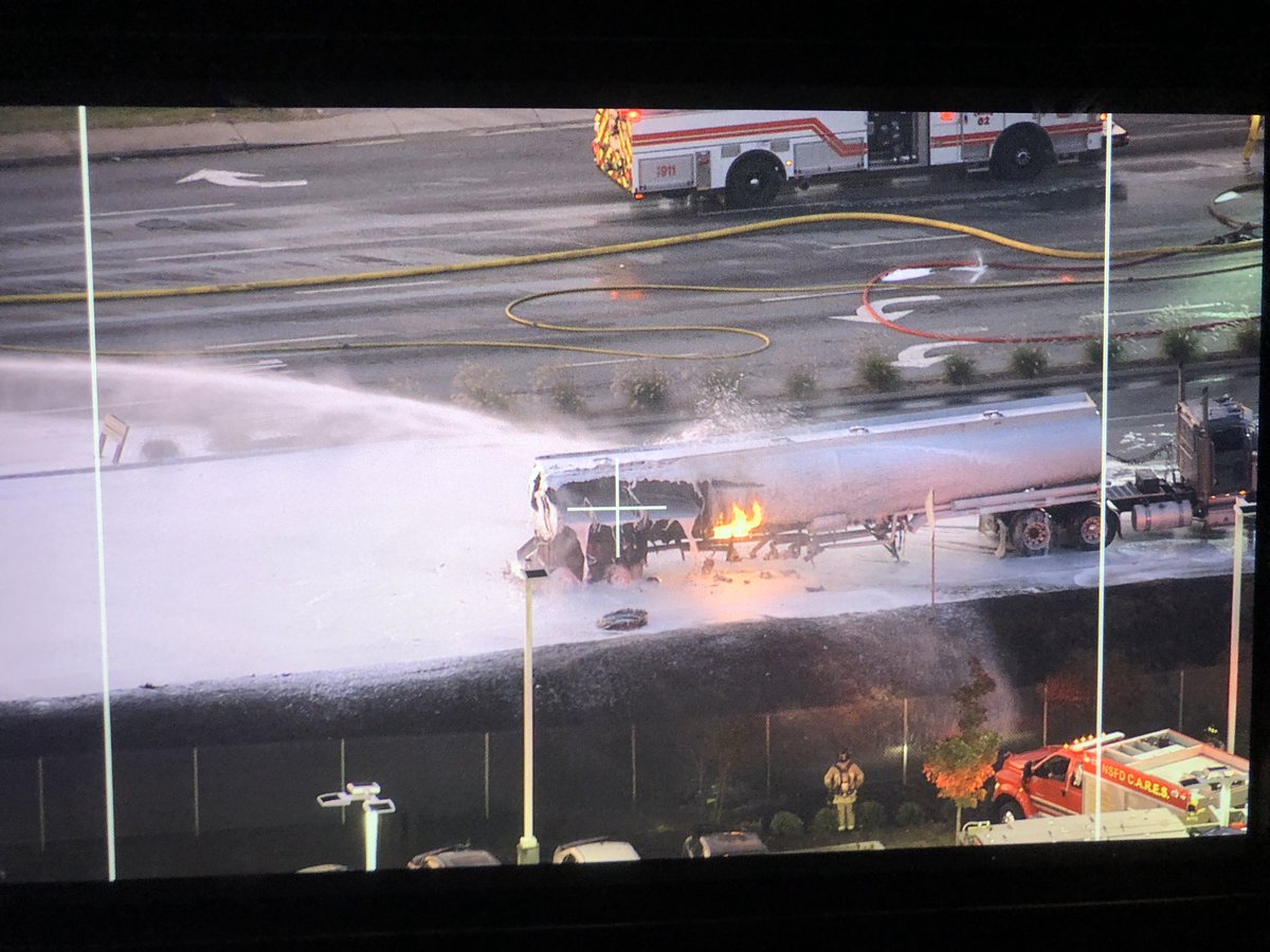 Flames knocked down as firefighters spray foam on the tanker fire. All lanes of Reidville Rd between Blackstock Rd and I-26 are blocked 