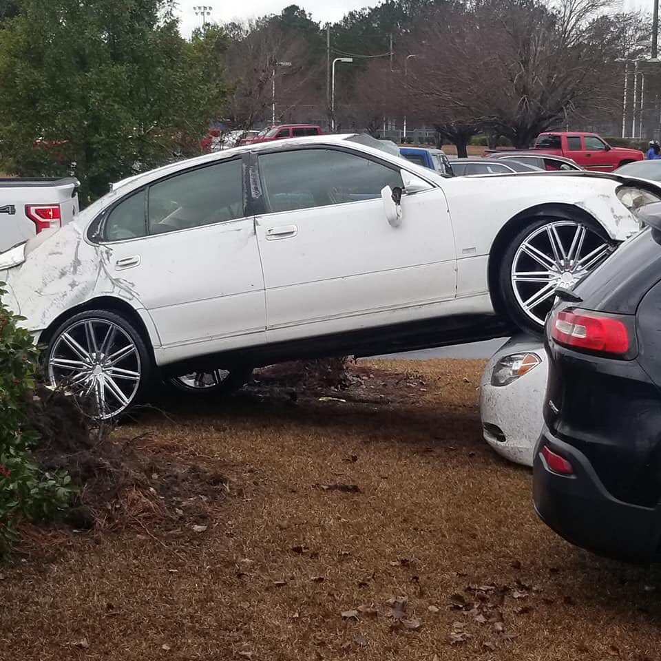 It appears a tornado touched down at Loris High School around 12:45pm this afternoon. No reports of injuries but there was significant damage to cars in the parking lot. 