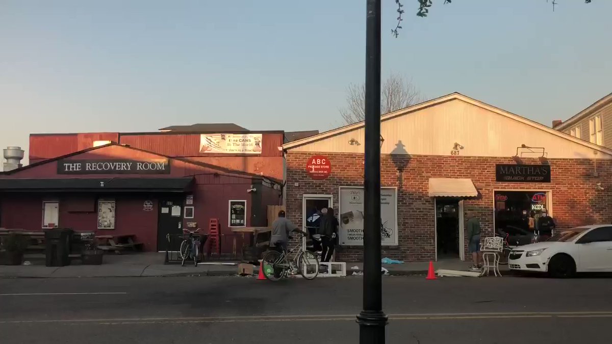 Individuals picking up things like alcoholic beverages off the ground right outside the liquor store. The distraught individual remains inside