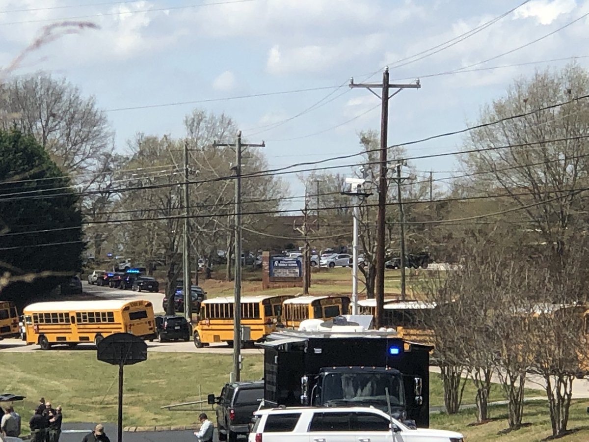 The current scene outside Tanglewood Middle School where a student was shot around 12:30PM in Greenville, SC. Law Enforcement continue to show up to the command center set up outside the school