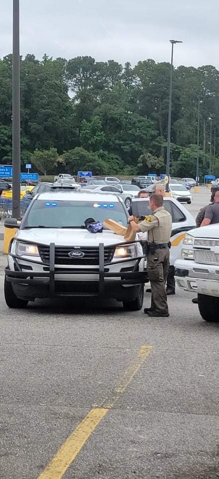 Several police and deputies are gathered outside the Walmart on South Irby Street in Florence. one person has been taken into custody.  Florence police plan to release more information in a few. 