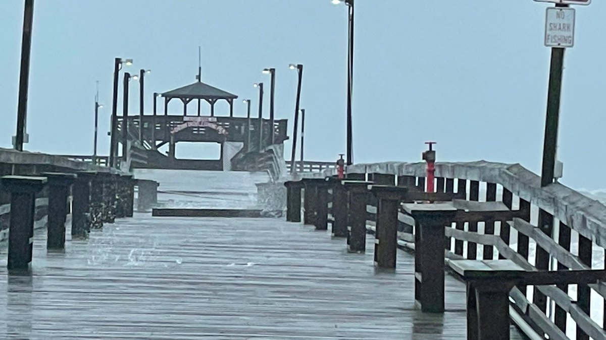 Waves crashing on Cherry Grove Pier